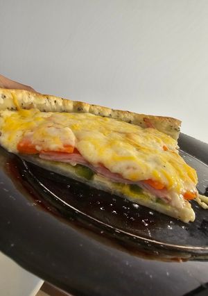 Una foto de Tarta de zapallitos zanahoria y bechamel