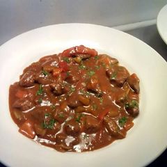 A picture of Beef in a red wine sauce.