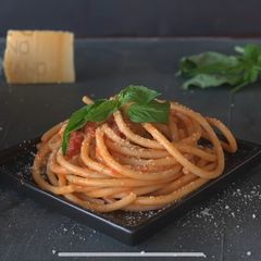 A picture of Pasta with a tomato sauce.
