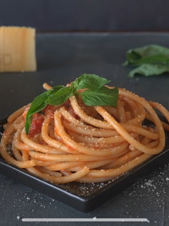 A picture of Pasta with a tomato sauce.
