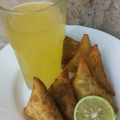 A picture of Beef samosas with juice...