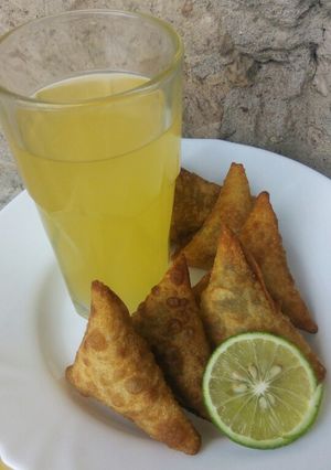 A picture of Beef samosas with juice...