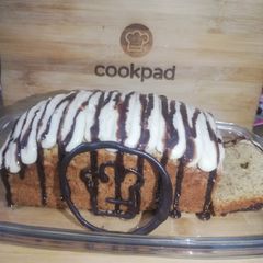 A picture of Banana Bread with Cream cheese frosting.