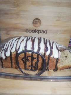 A picture of Banana Bread with Cream cheese frosting.