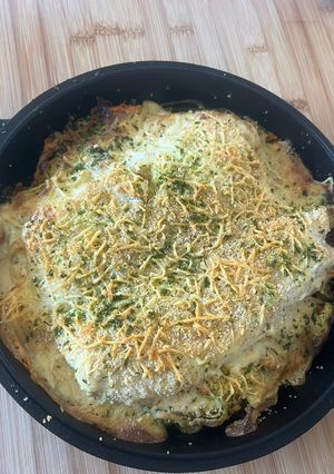 Une photo de Cabillaud Gratiné Courgettes et Carottes en Tagliatelles Agrémentées de Semoule