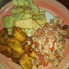 A picture of Fried yam and plantain with egg sauce.