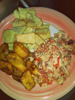A picture of Fried yam and plantain with egg sauce.