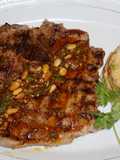 Grilled Pork Chops with Pine Nut Chimichurri and White Bean Timbale