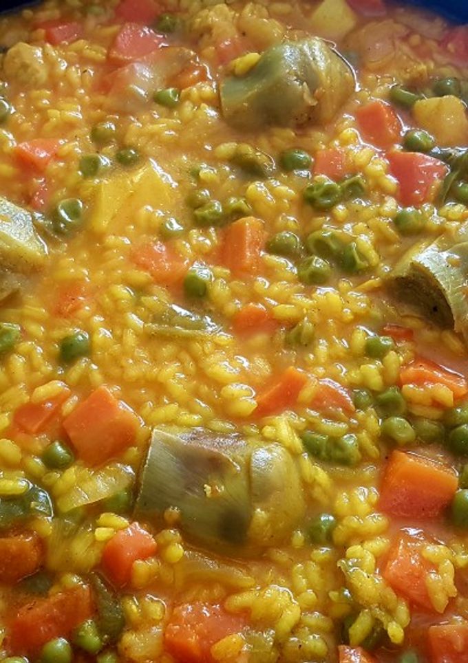Una foto de Arroz con alcachofa, sepia y solomillo de pavo