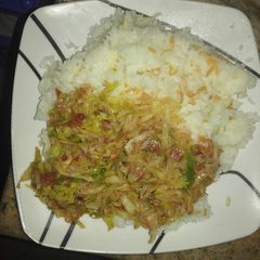 A picture of Simple rice and fried vegetables.
