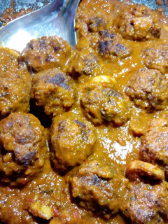 A picture of Meatballs with mushrooms in coconut sauce.
