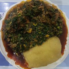 A picture of Vegetable soup and eba.