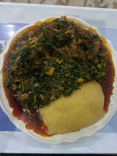 A picture of Vegetable soup and eba.