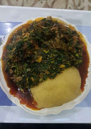 A picture of Vegetable soup and eba.