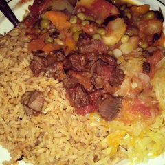 A picture of Beef stew with rice.