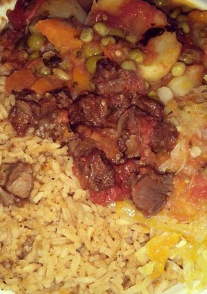 A picture of Beef stew with rice.