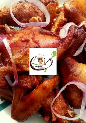 A picture of Fried chicken in tomatoe sauce.