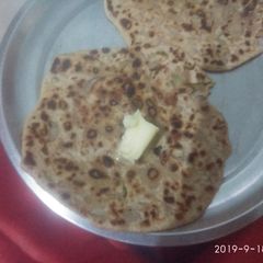 Onion paratha with butter A picture of Onion paratha with butter.