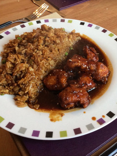 A picture of Sesame Chicken with Egg-Fried Rice.