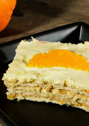 O poză a rețetei Prăjitură cu biscuiți, cremă de brânză și portocale - fără coacere.