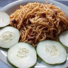 A picture of Jollof spaghetti,diced beef and vegetable.