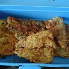 A picture of Fried hake fish.