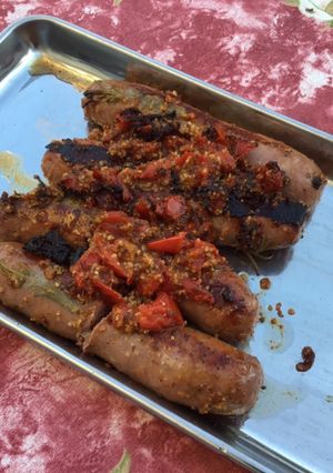 Une photo de Saucisses de Toulouse grillées aux tomates,romarin et épices