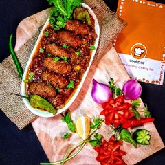 A picture of Seekh Kabab In Tomato Gravy..