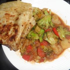 A picture of Brocolli served with chapati.