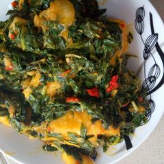 A picture of Yam porridge with vegetables.