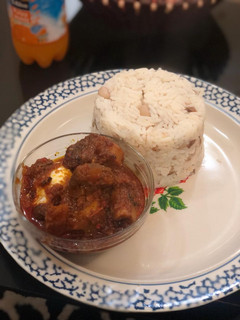 A picture of Rice, beans and stew.