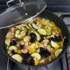 A picture of Chicken and Zucchini stir fry.