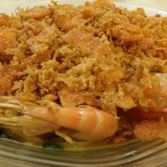 A picture of Butter Prawn with Salted Egg and Floss Garnishing.