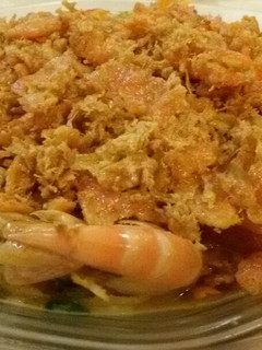 A picture of Butter Prawn with Salted Egg and Floss Garnishing.