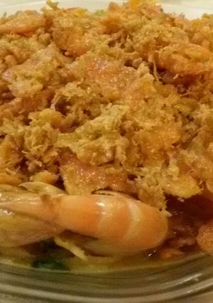 A picture of Butter Prawn with Salted Egg and Floss Garnishing.