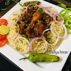 A picture of Tandoori Chicken with Garlic Rice.