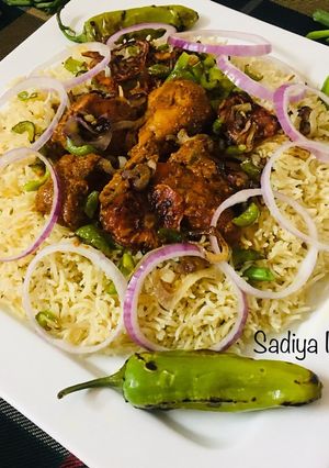 A picture of Tandoori Chicken with Garlic Rice.