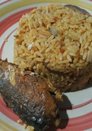 A picture of Jollof rice and fried fish.