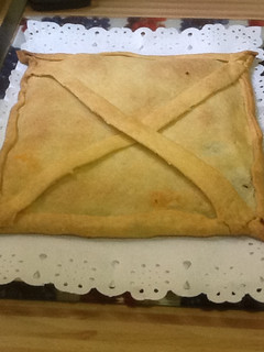 Una foto de Empanada de morcilla, manzana y cebolla caramelizada