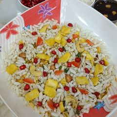 A picture of Rice puff with Pomegranate bhel chat.