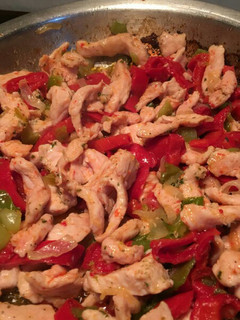 Una foto de Relleno para fajitas de pollo, pimiento y cebolla
