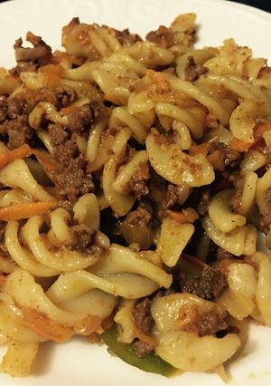 A picture of Fusilli pasta with mince meat.