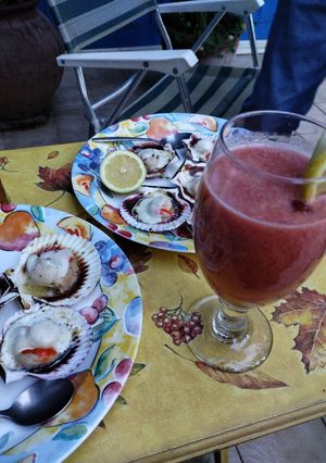 Una foto de Ostiones a la parmesana en concha