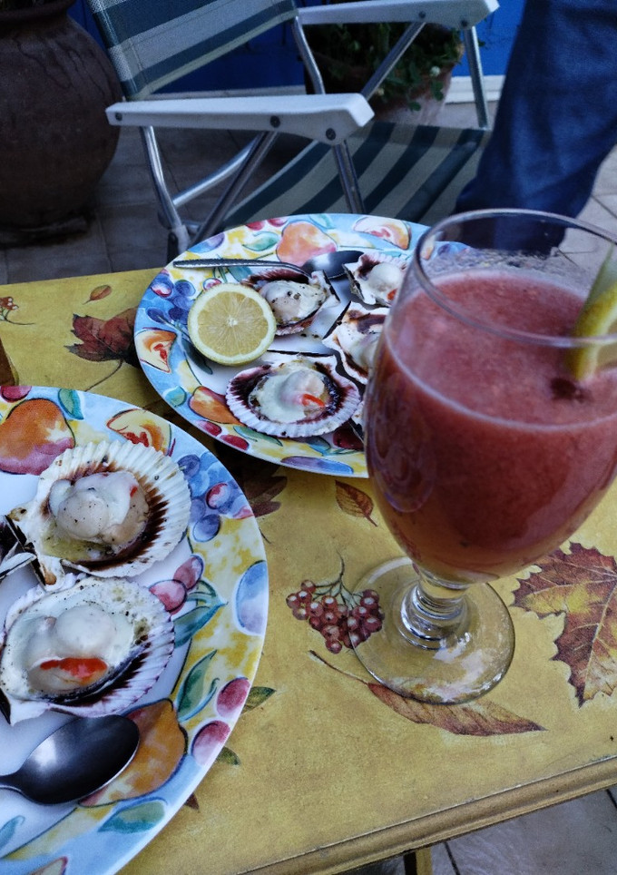 Una foto de Ostiones a la parmesana en concha