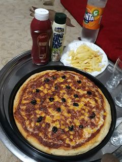 صورة لوصفة بيتزا لذيذة راح تدعولي بس تجربوها 😘❤