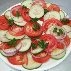 A picture of Tomato cucumber salad.