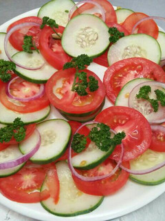 A picture of Tomato cucumber salad.