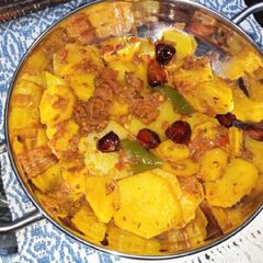 A picture of Tomato Chilli Potato Fry.