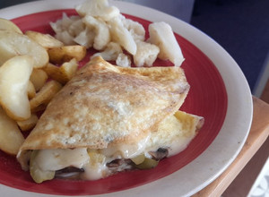 Una foto de Omelette de champiñones y aceitunas