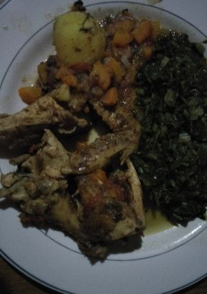 A picture of Chicken stew with greens.